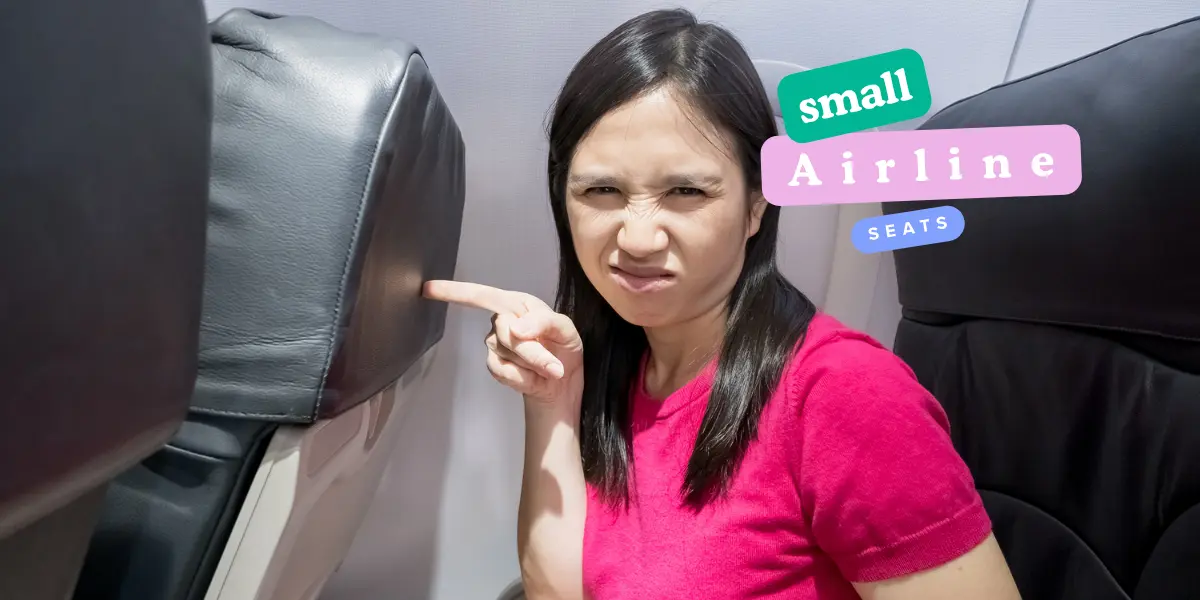 girl pointing out small airline seats in economy class