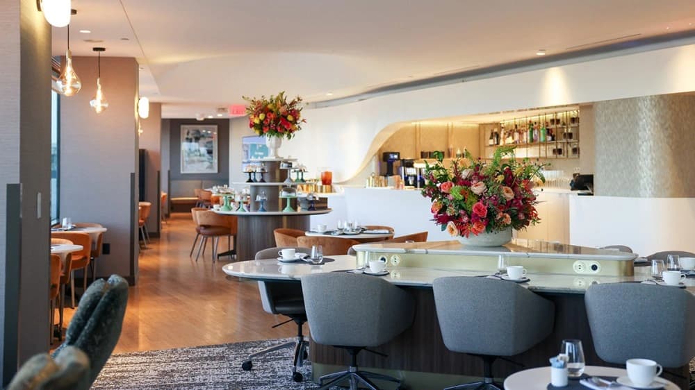 Modern delta airlines airport business lounge with lounge seating and warm lighting at terminal 2
