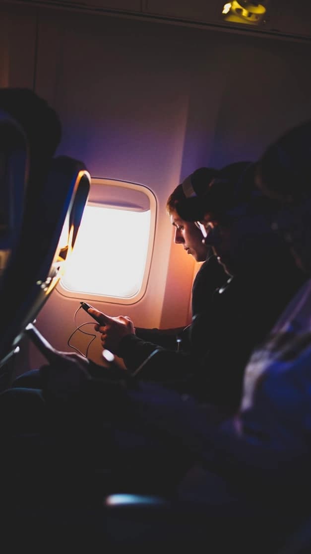 passenger wearing headphone in united airlines